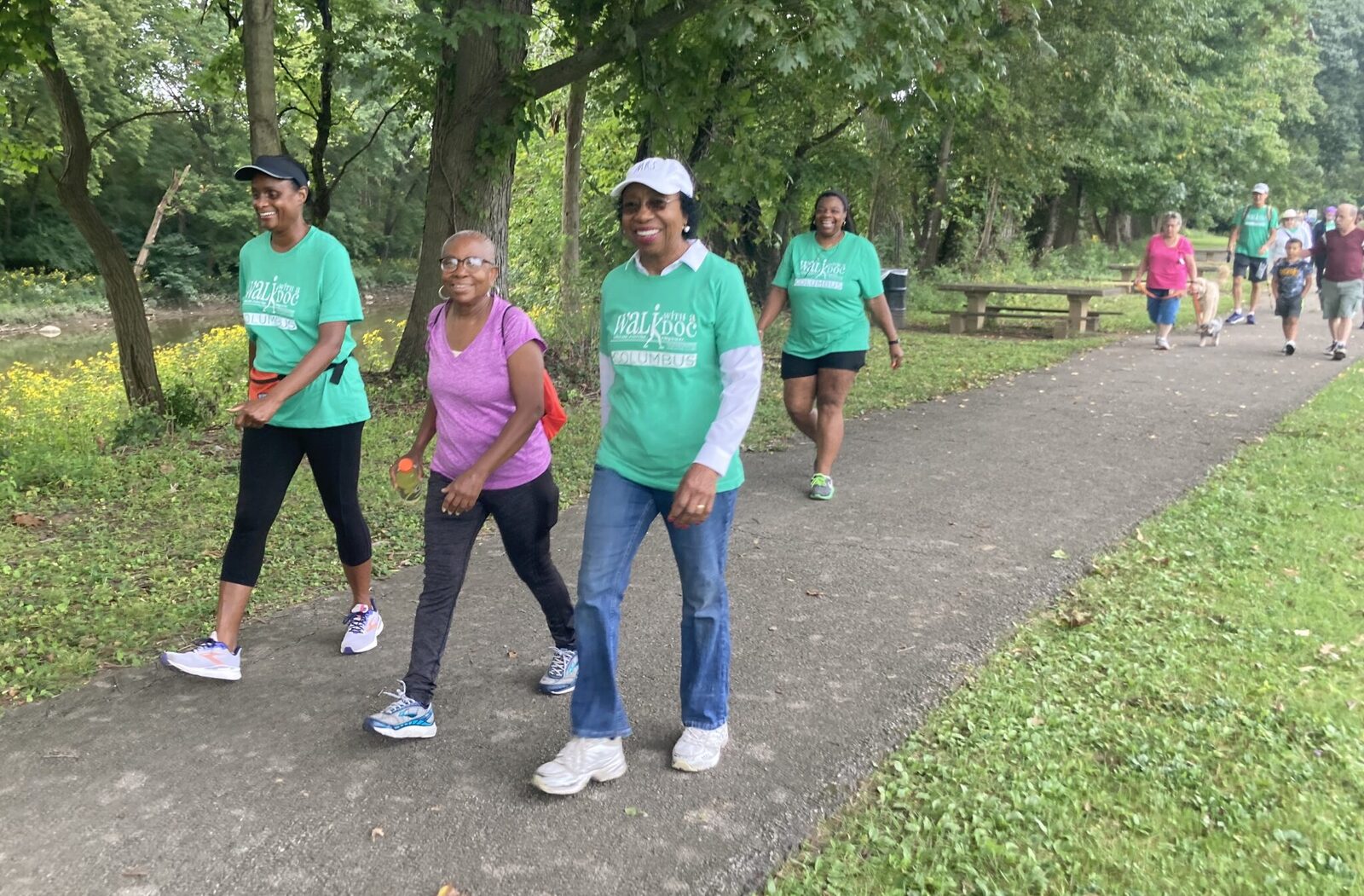 The Well Walkers group walking together at A.M. Rodgers Park in Canton